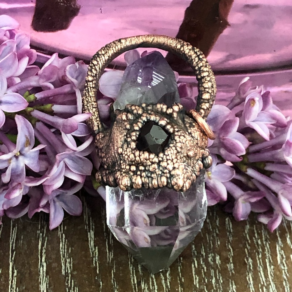 This is a hand made pendant.